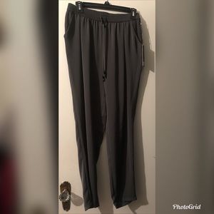 Jennifer Lopez silky pants with tapered leg